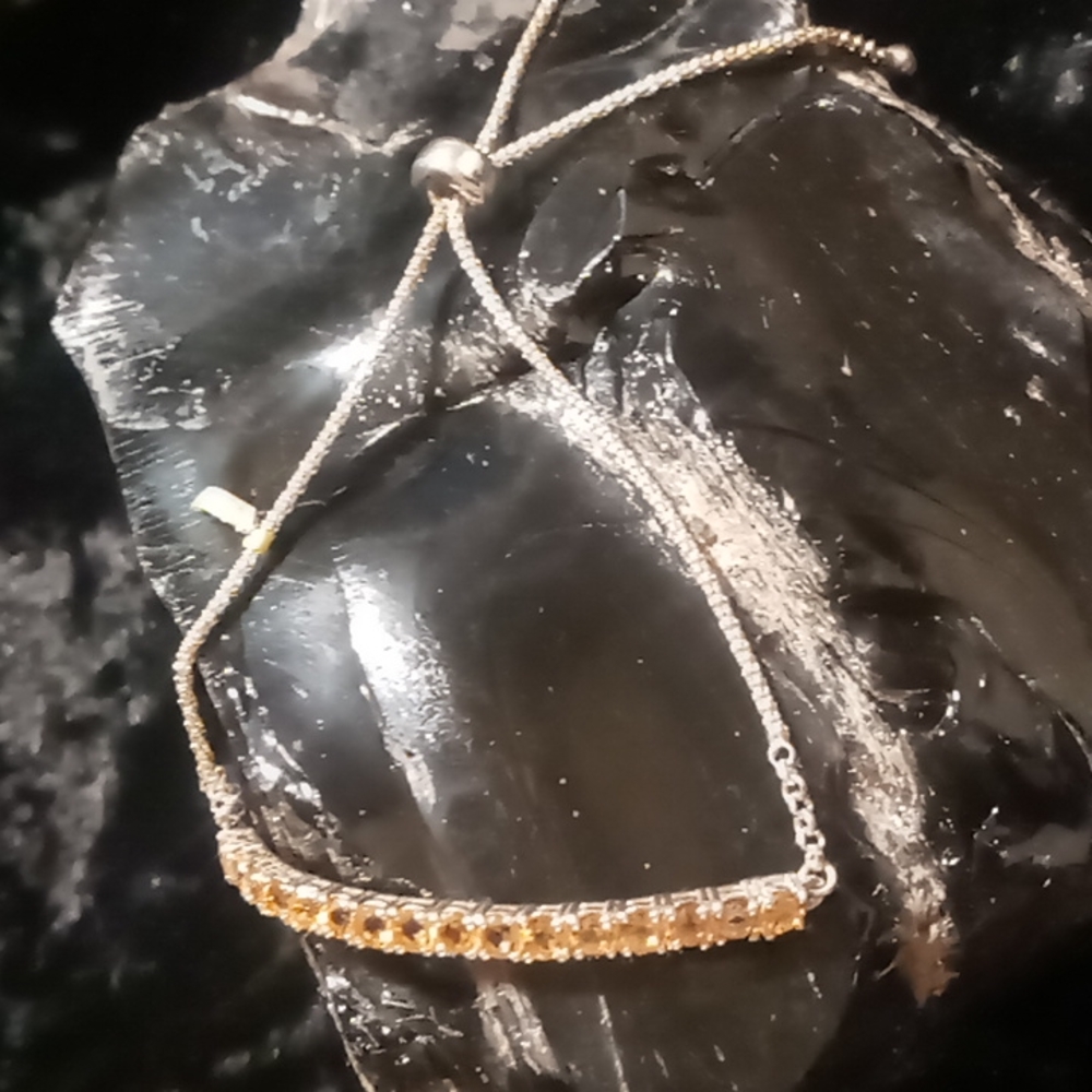 Citrine yellow topazes slide bracelet in sterling silver.fits up to a size 10.
